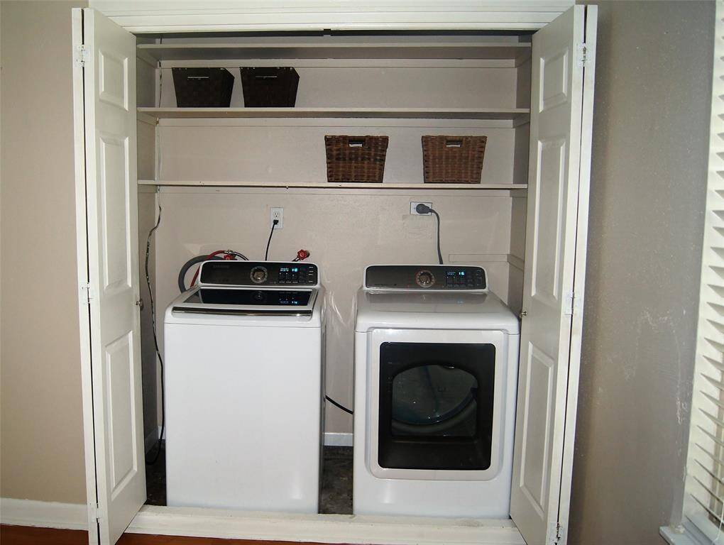LAUNDRY AREA WITH STORAGE SHELVES