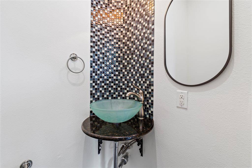 Convenient first-floor powder room for guests with modern fixtures and finishes.