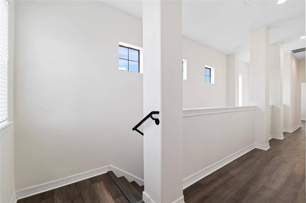 Transitional stairway connects first-floor entertaining with private upstairs retreats.