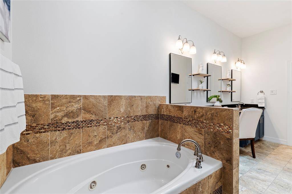 Enjoy a daily retreat with this thoughtfully designed and updated primary bath.