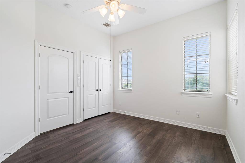 Clean lines and soft tones make this secondary bedroom a flexible, inviting space.