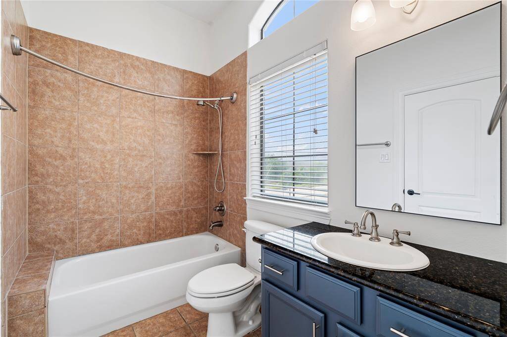 Thoughtfully designed secondary bathroom serving both bedrooms with style.