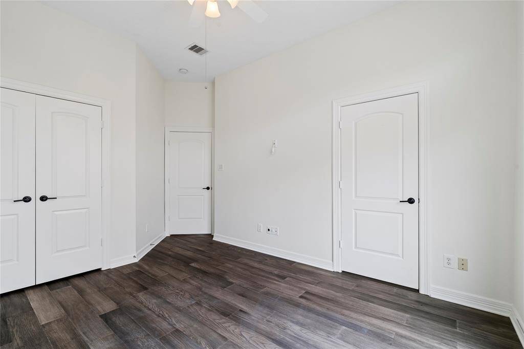 Comfortable secondary bedroom ideal for multi-use living or guests.