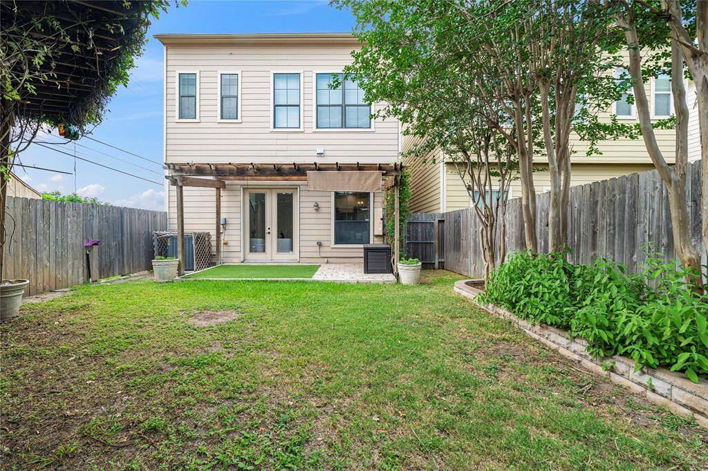 Perfectly sized backyard offers a rare combination of privacy and function in the city.