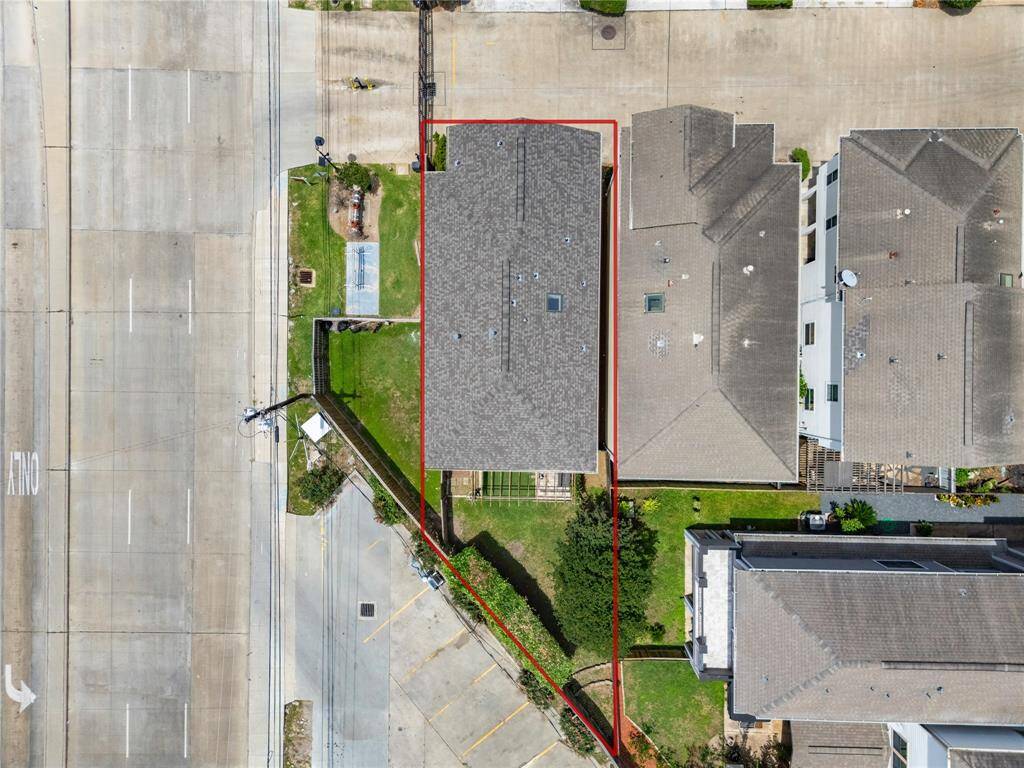 Bird’s-eye perspective highlights the private lot and fenced yard, tucked securely within a quiet enclave.
