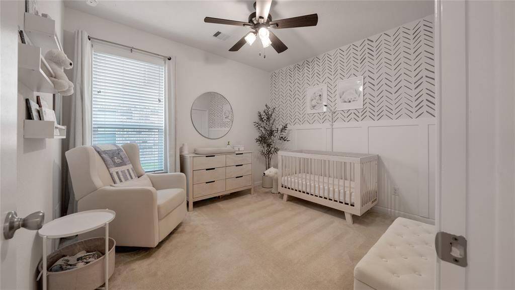 Neutral nursery with custom accent wall.