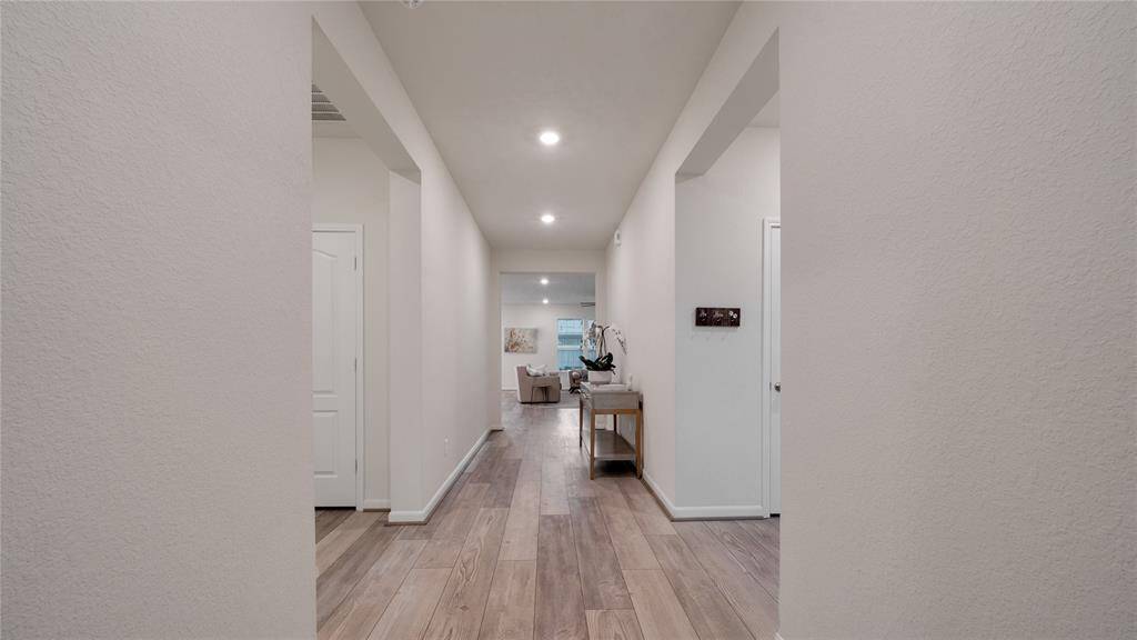 Come on in. Your guests are greeted by a long, wide entry.