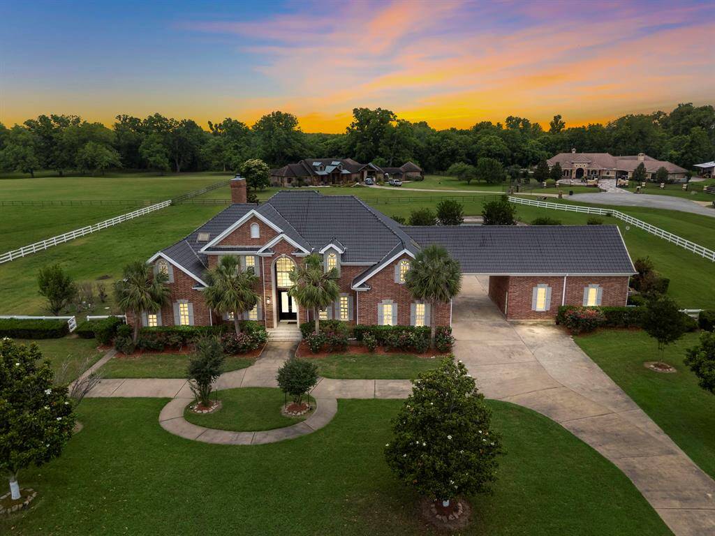 This stunning all brick home lies on 2.4 Acres in the Grand River community.