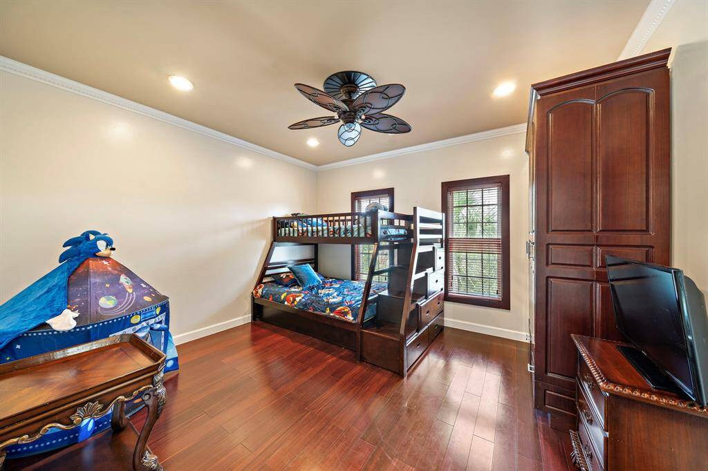 Upstairs secondary bedroom with an en-suite bath. The built out cabinets are for closet space.