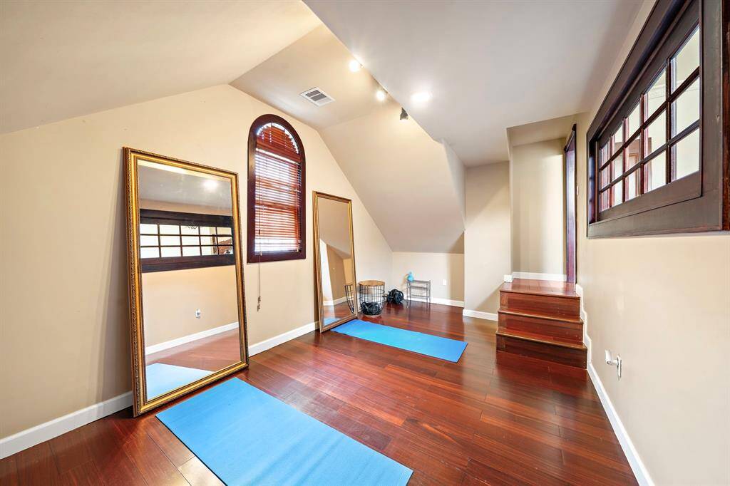 Next to the staircase is this flex room currently used as a home gym.