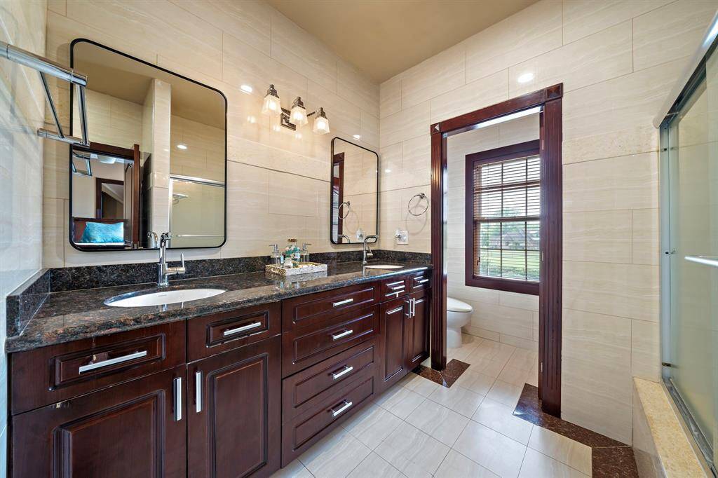 The hallway bathroom is used by the bedroom adjacent and the one across the hall.