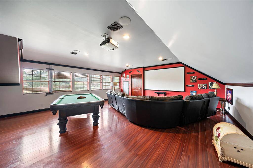 This room is above the 2 car garage which makes it idea for the noise situation. The door in the back leads to the garage.