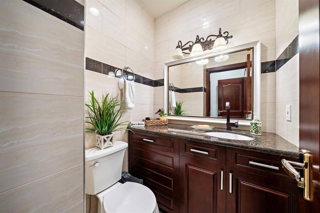 Downstairs powder room near the dining area.