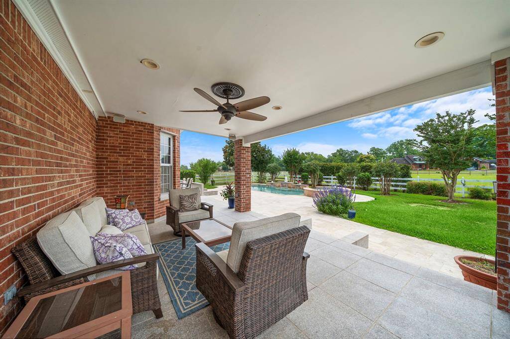 The covered patio has steps up to it and you can enter into the back kitchen.