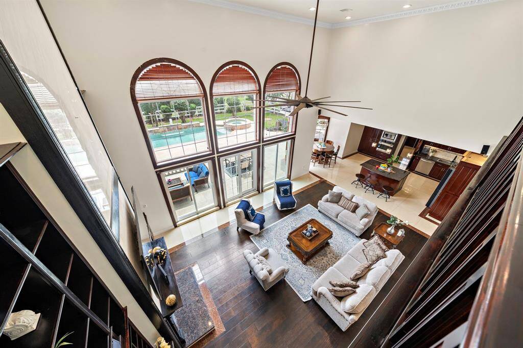 From the second floor you can see how the living room and kitchen have views of the pool.