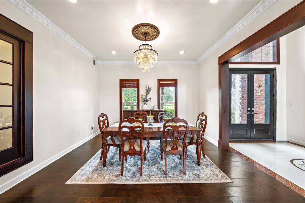 The formal dining room is next to the front door and has a beautiful crystal chandelier.