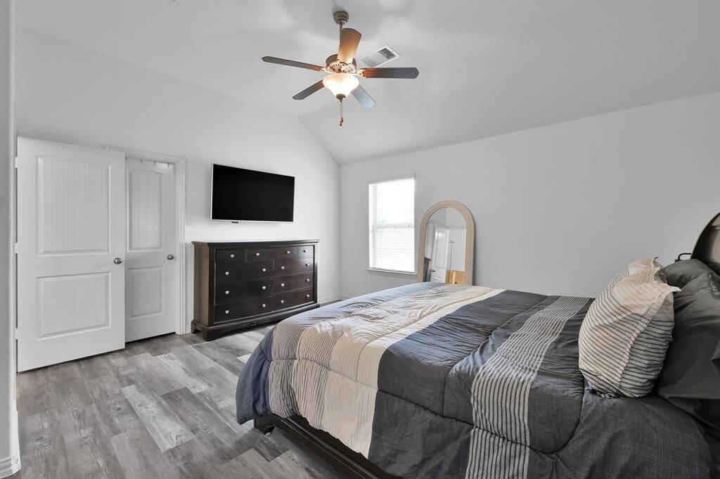 Primary bedroom with a large walk in closet.