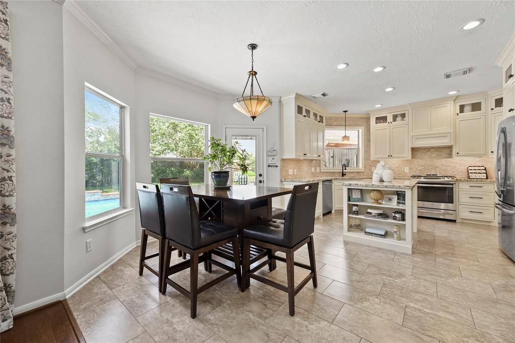Dine in the kitchen eating area for views of the sprawling backyard! Tons of windows provide excellent sightlines and allow shimmering natural light to flood the home in luminosity.