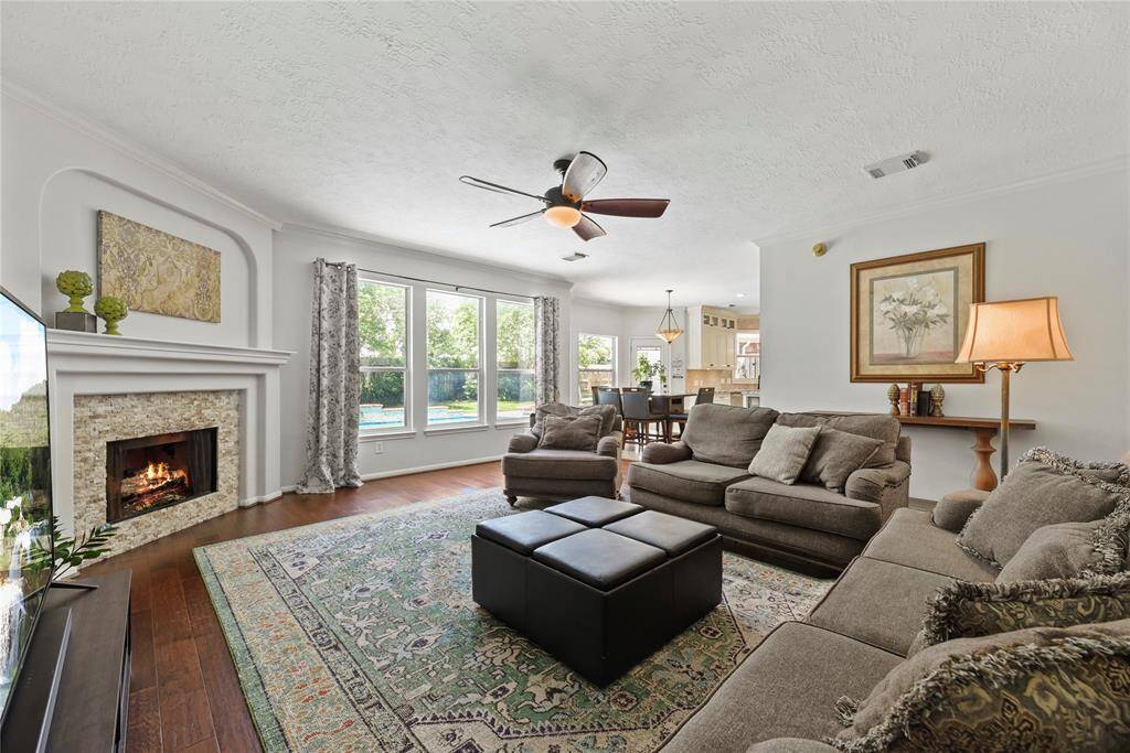 Welcoming and conveying warmth, the living room offers an inviting space for evening movies or holiday gatherings. Tune into your favorite streaming show, while admiring the cozy fireplace.