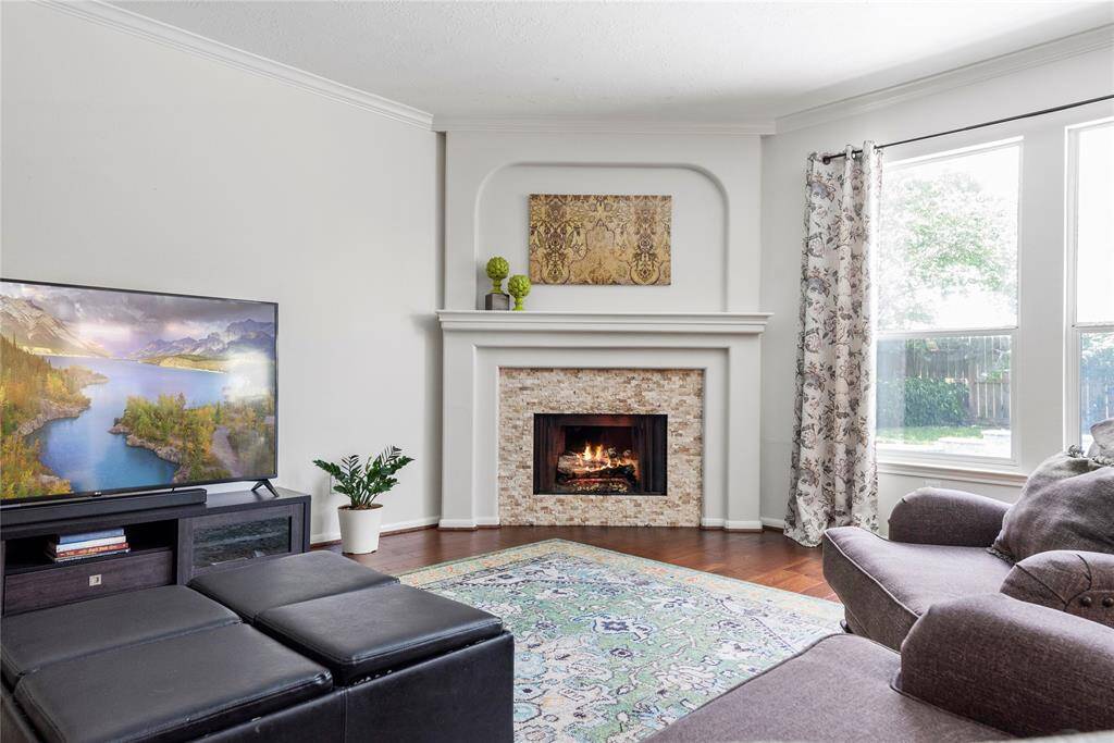 Boasting a stately surround and mantle, the fireplace is the perfect place to display worldly treasures and favorite photos of family and friends. While you sit and read, you will always have a smile on your face when you look at your most valued relationships and experiences!