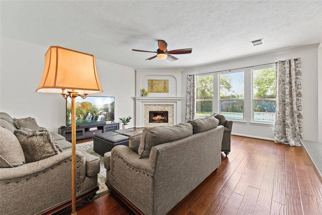 Several windows in the family room display an amazing view of the spectacular backyard!
