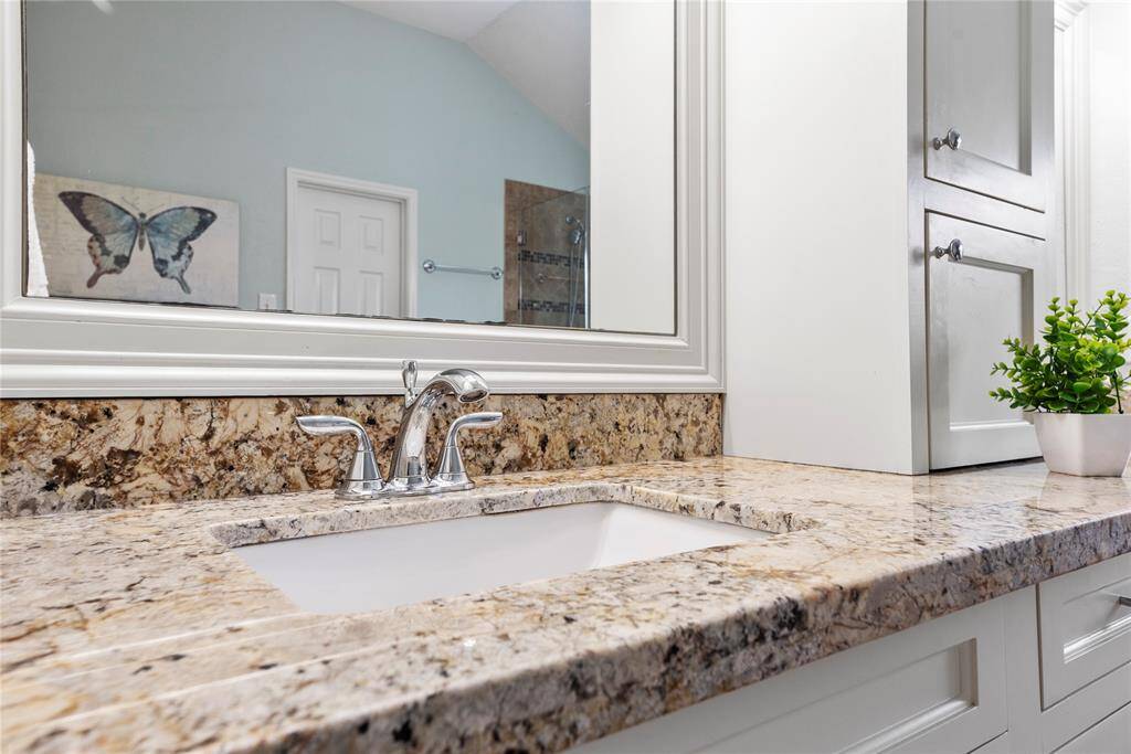 Exquisitely finished, the primary bedroom en suite has dual sinks and tons of storage cabinetry for self-care items. Each partner may easily get ready in the morning with ease and comfort.
