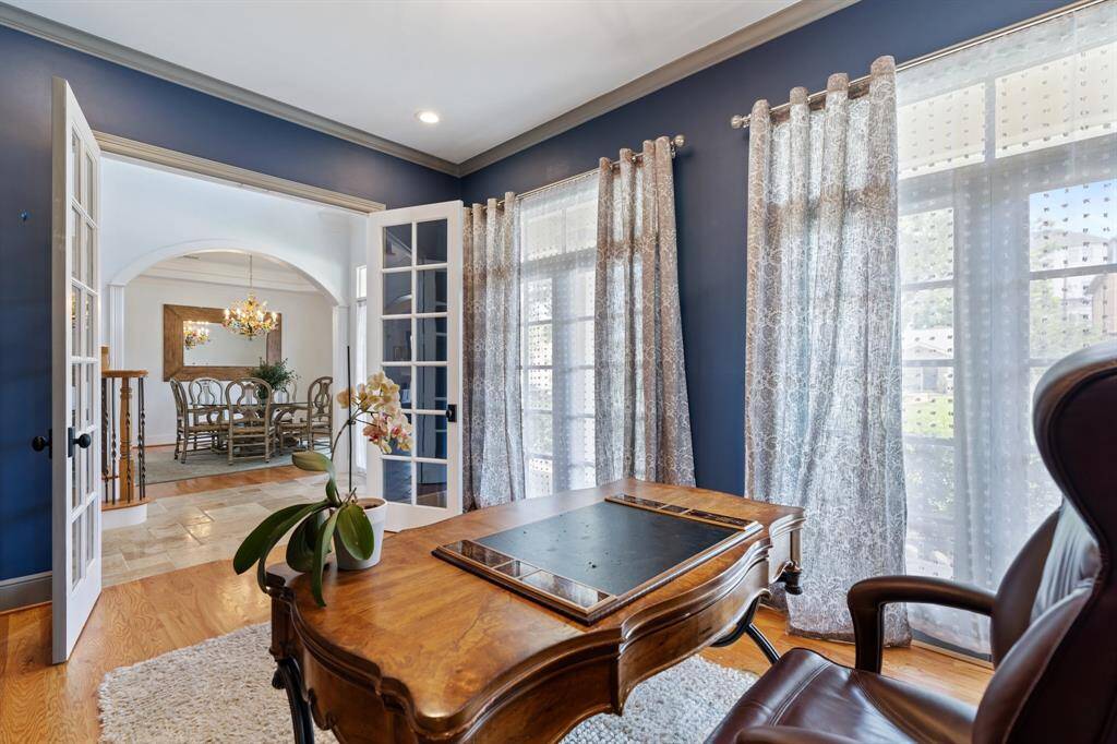 The home office/study is filled with natural light, ideally positioned just off the entry for convenience.