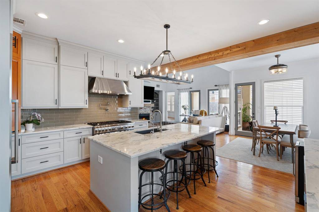 The kitchen opens to the breakfast area and family room.