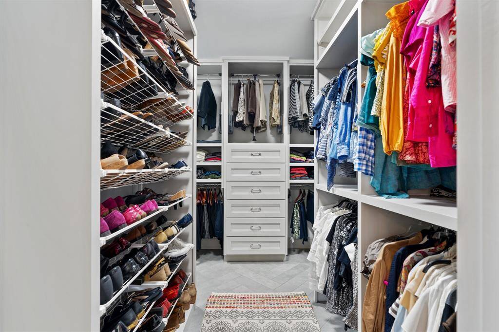 The expansive walk-in primary closet offers abundant storage and organization space—designed for both luxury and functionality.
