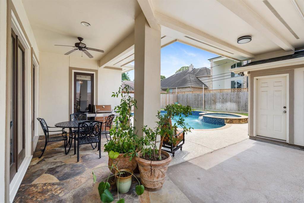 The covered backyard patio and pool provides the perfect setting for outdoor entertaining and year-round enjoyment.