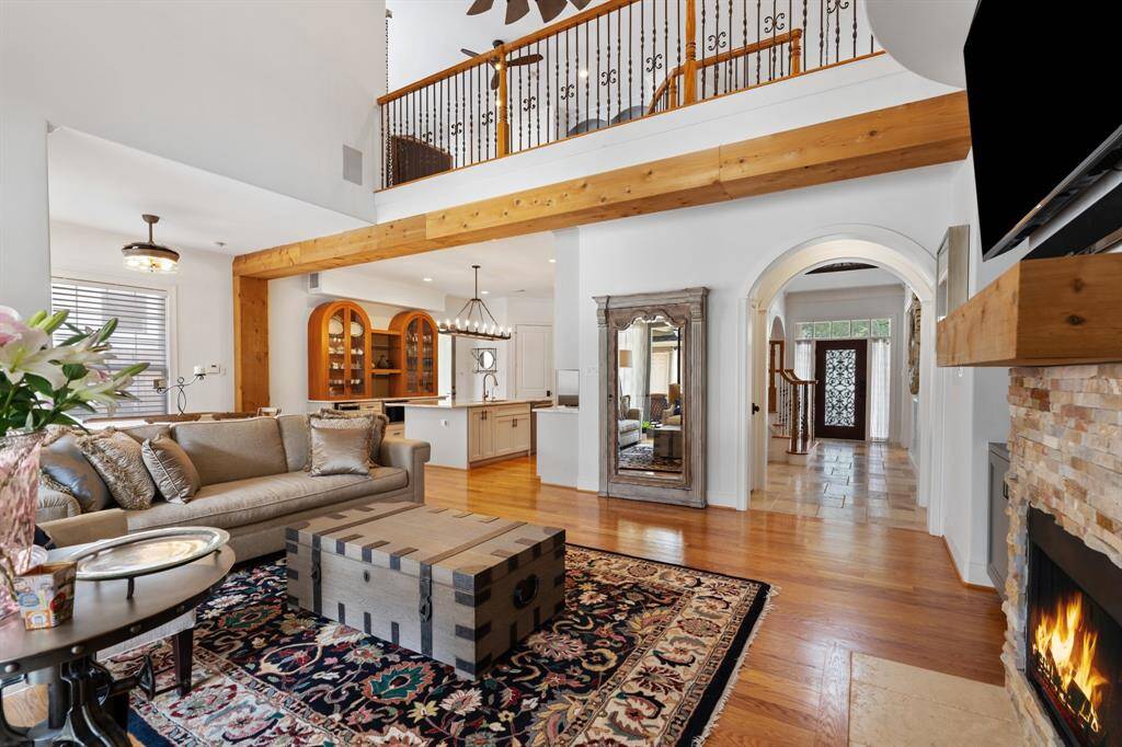 The family room seamlessly connects to the breakfast area, kitchen, and entry, creating an ideal space for entertaining.