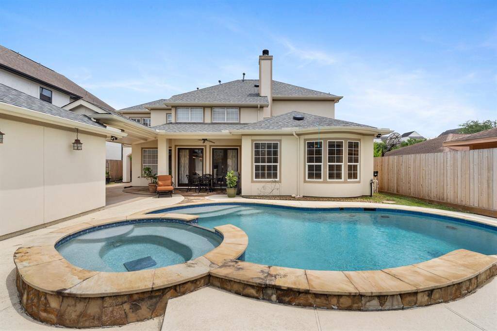 Enjoy the fantastic pool and spacious covered patio—perfect for relaxing or entertaining year-round.