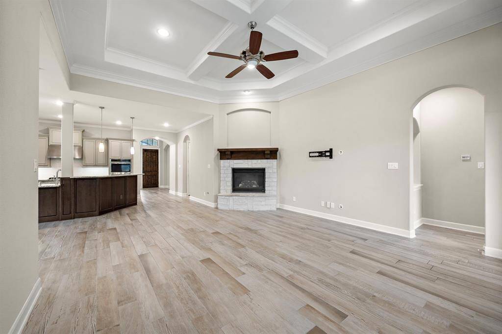 The living room features crown molding and a gaslog fireplace.