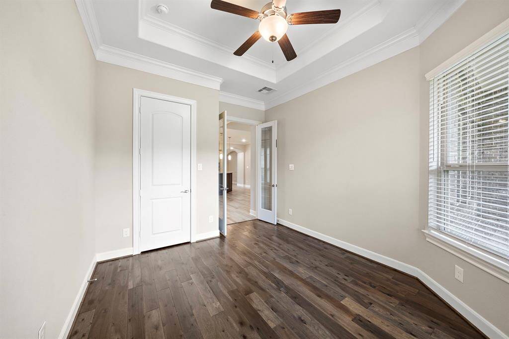 The office is located off of the breakfast area and features french doors.