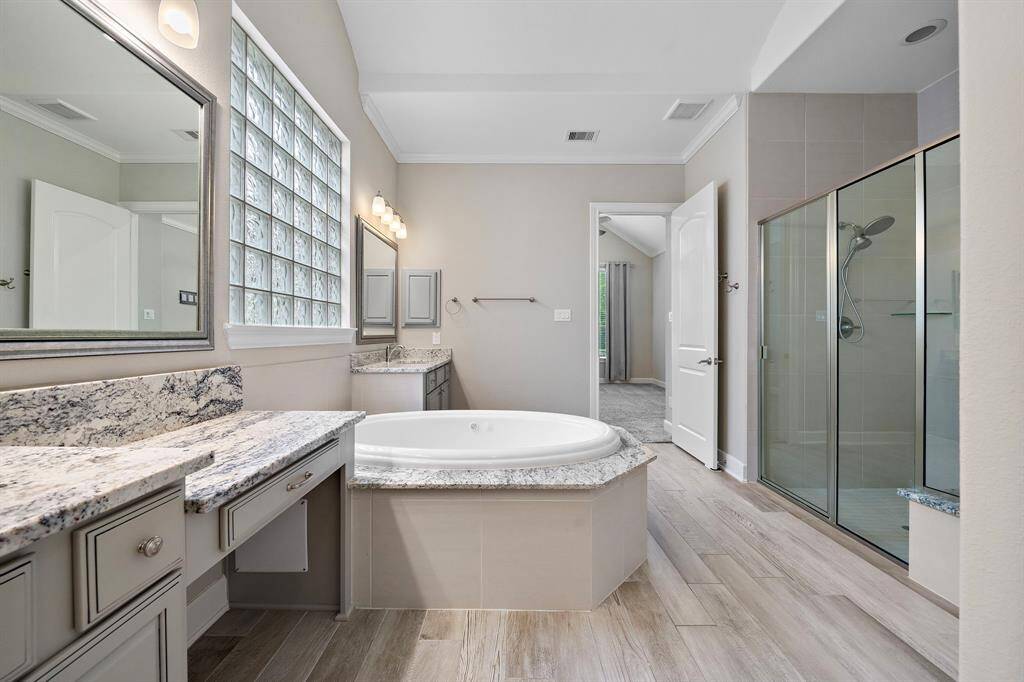 The primary bathroom also features an oversized walk-in shower.