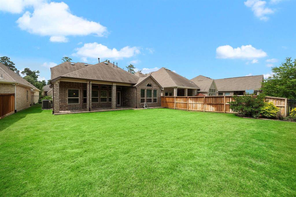 The backyard is large enough for a pool, playset, and garden!