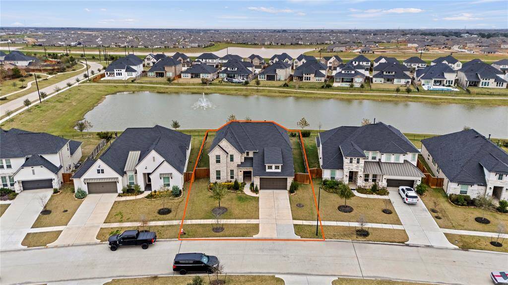 This impressive aerial view showcases the prime location of this lot, perfectly positioned with a scenic lake backdrop.