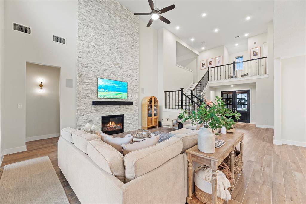 The modern design of this inviting fireplace becomes a focal point that anchors the room and invites people to gather and linger, making it a cherished feature of the living area.