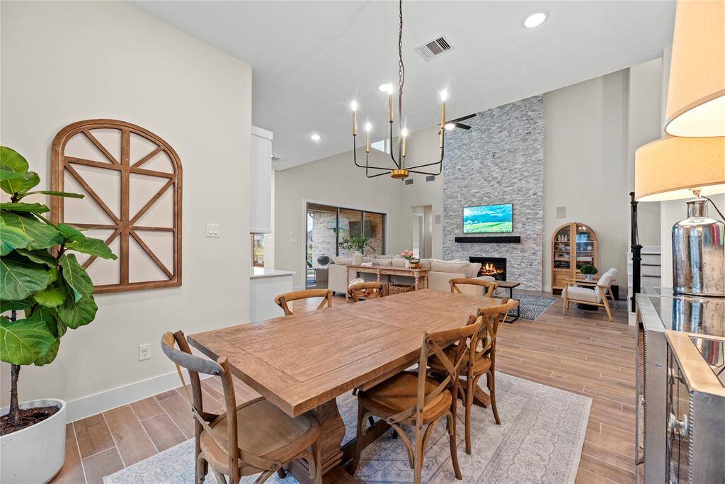 The living room, adjacent to the kitchen and dining area, offers a comfortable and inviting space for relaxation and socializing.