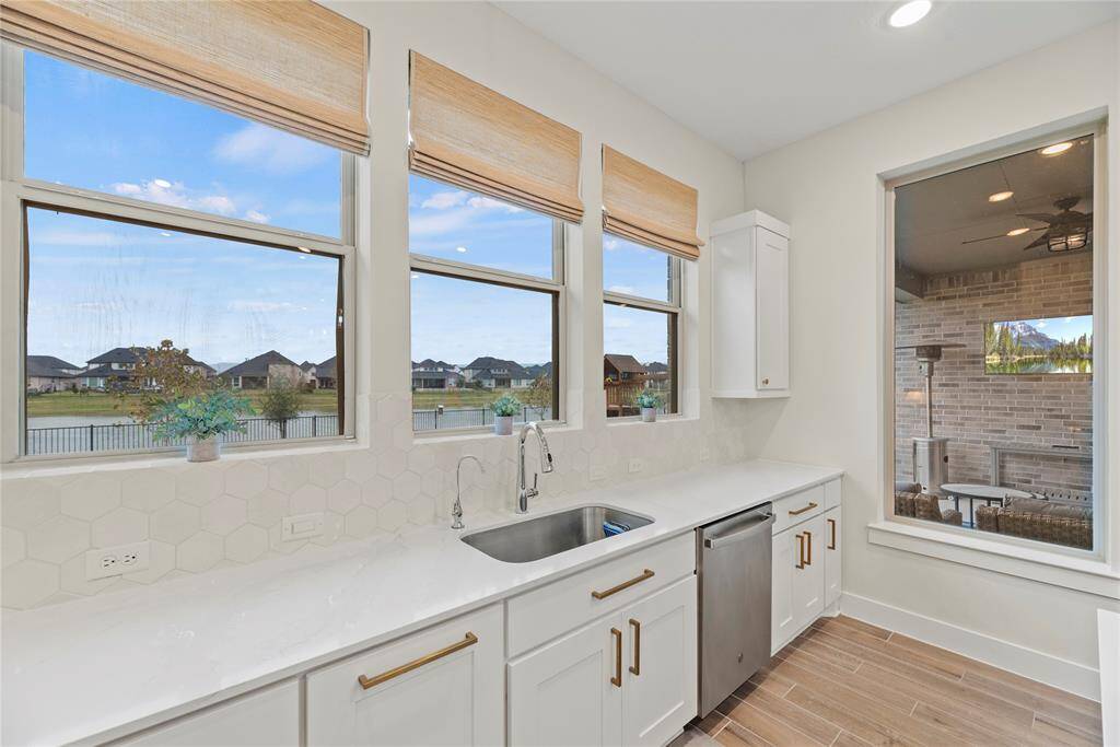 Standing at the sink, look out and enjoy the atmosphere throughout this inviting home.