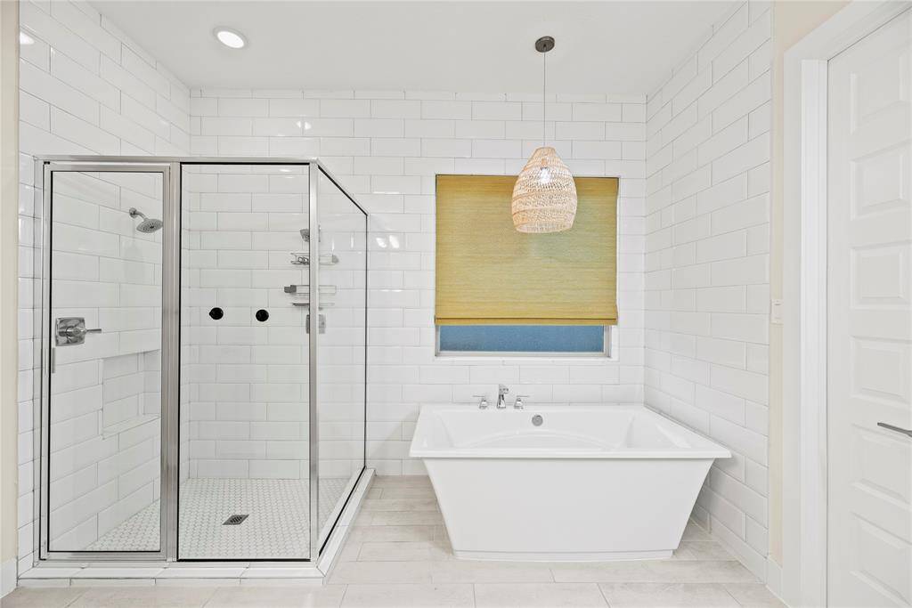 Unwind in your deep soaking tub or jump in the separate oversized shower for a quick rinse.
