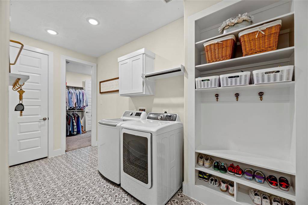 This well-appointed laundry and mud space includes ample storage and efficient organization, making laundry day a breeze while keeping your home tidy and functional.