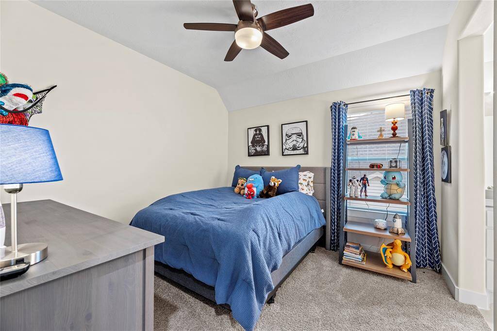 With ample room to accommodate various arrangements, the fourth bedroom serves as a perfect retreat for family or guests.