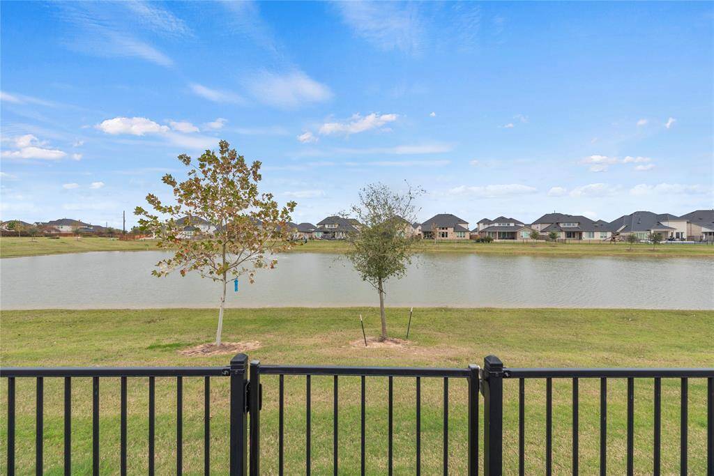 Enjoy the ultimate in convenience and privacy with direct access through the back gate to serene walks that wind around the private lake.