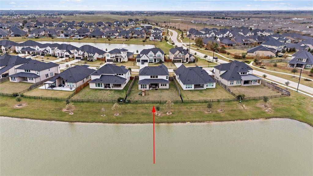 From this aerial view of the back of the home, you can fully appreciate its beauty, elegance, and remarkable charm.
