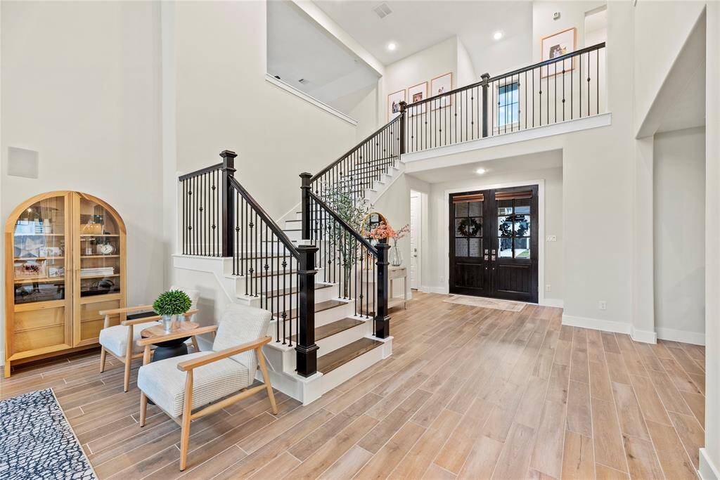 This entrance is a showstopper! Whether it's for guests arriving for the first time or for the homeowners returning at the end of the day, stepping through this doorway is sure to evoke a sense of pride and joy.