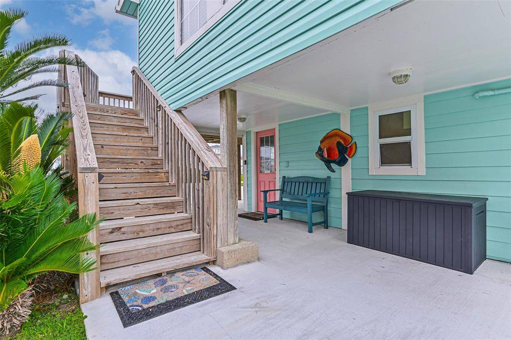 Covered side patio and 12 steps to the upper deck