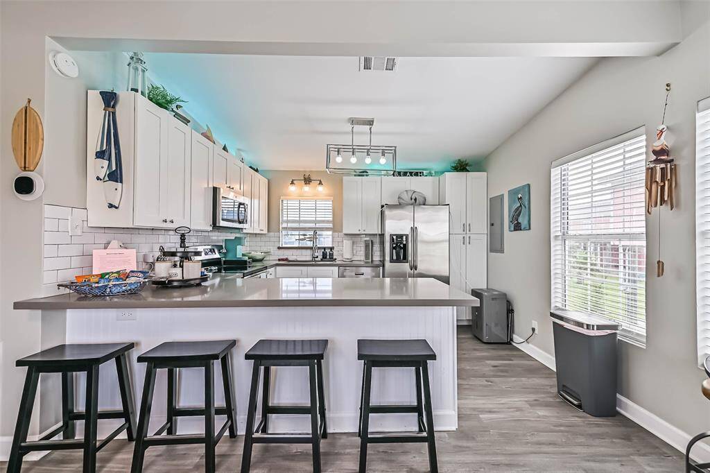 Kitchen with counter bar stools
