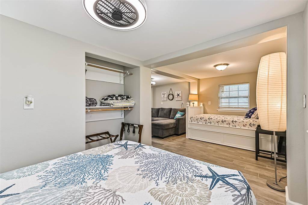 Ground level sleeping and storage space adjacent to living space