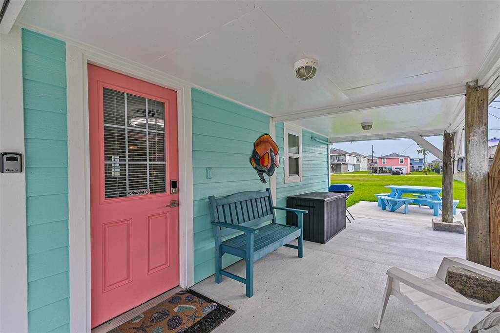 Side patio with door to ground level living space